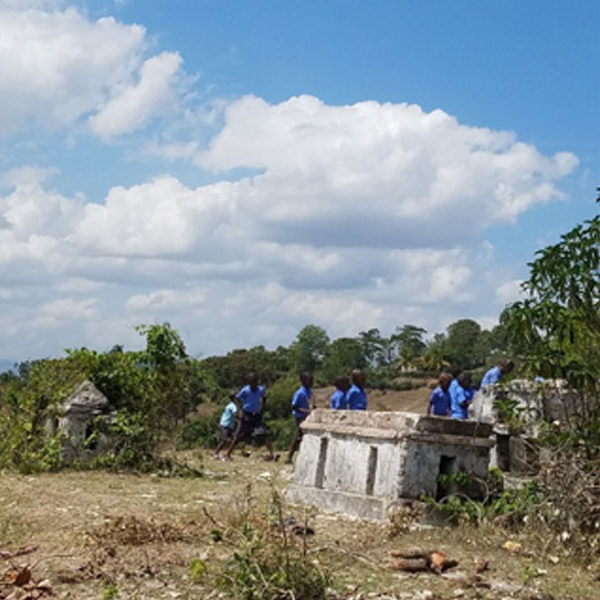 Current playground, a "soccer" field in the cemetery across the street from the school